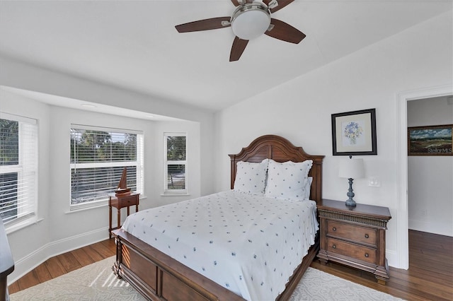 bedroom featuring ceiling fan and dark wood-type flooring