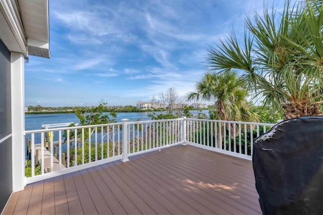 deck featuring grilling area and a water view