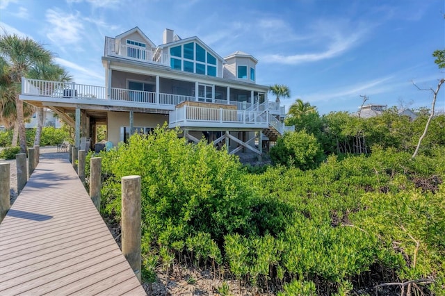 back of property featuring a sunroom