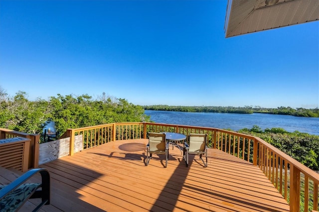 wooden deck featuring a water view