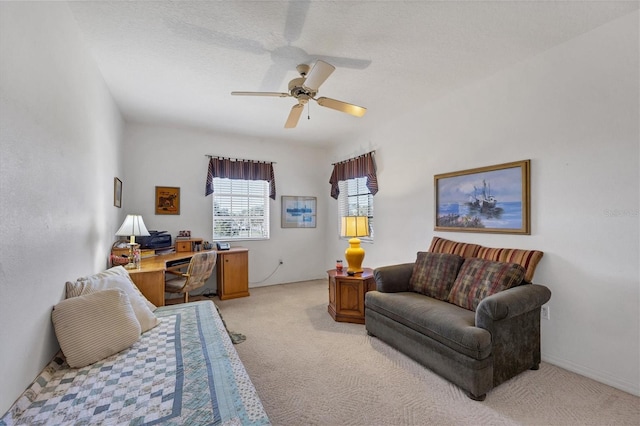 interior space with ceiling fan and a textured ceiling