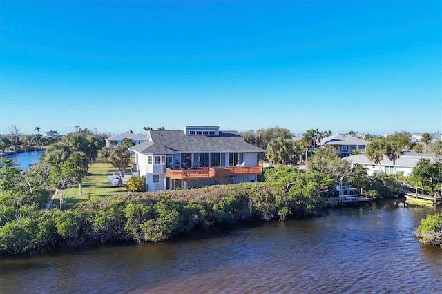 rear view of house with a water view