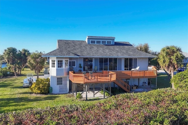 back of house with a lawn and a wooden deck