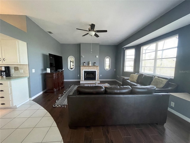 living room with ceiling fan and hardwood / wood-style flooring