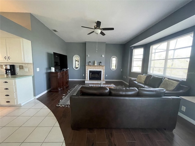 living room with hardwood / wood-style floors and ceiling fan