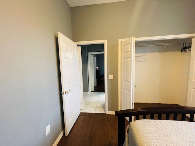 bedroom with a closet and hardwood / wood-style flooring