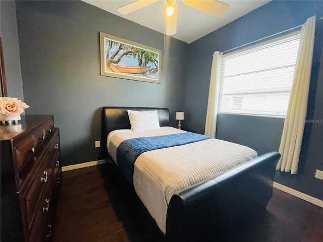 bedroom featuring ceiling fan and dark hardwood / wood-style floors