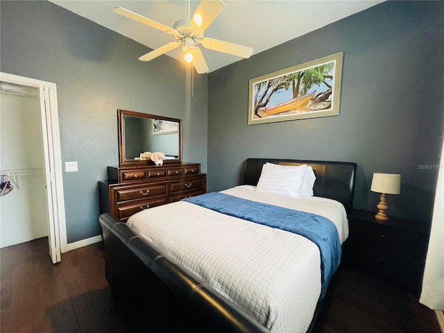 bedroom featuring ceiling fan and dark hardwood / wood-style floors