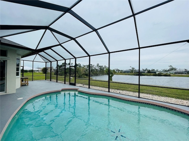 view of swimming pool featuring a water view, a patio area, a lanai, and a lawn