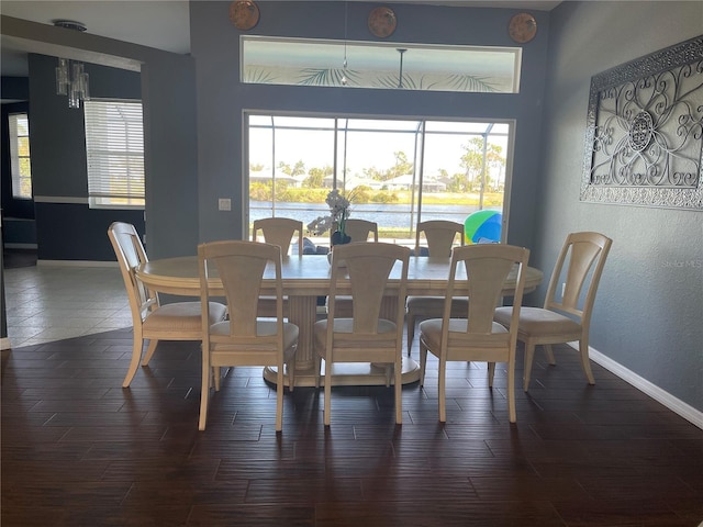 dining area with dark wood-type flooring