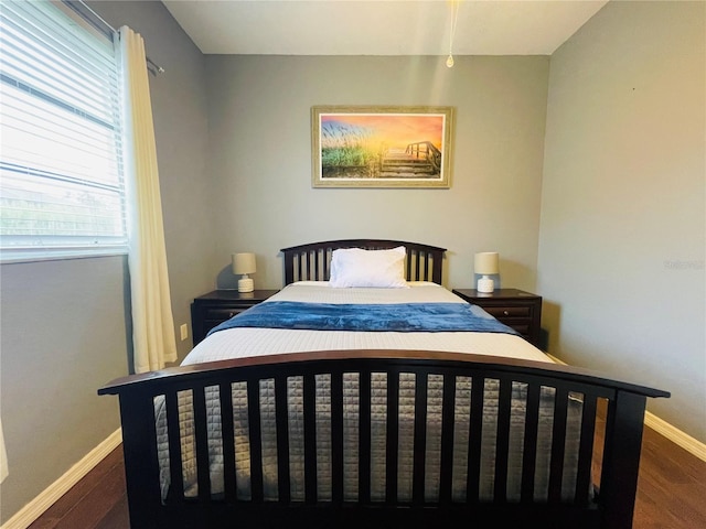 bedroom featuring dark hardwood / wood-style flooring