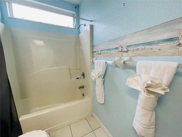 bathroom with tile patterned flooring, toilet, and shower / bath combo with shower curtain