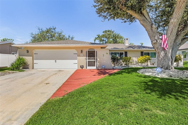 ranch-style house with a garage and a front lawn