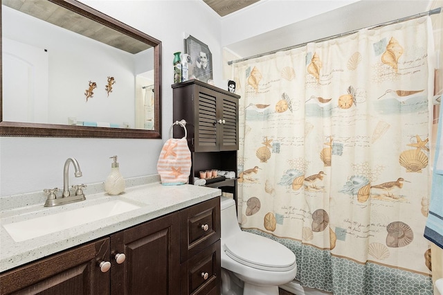 bathroom with vanity, toilet, and walk in shower