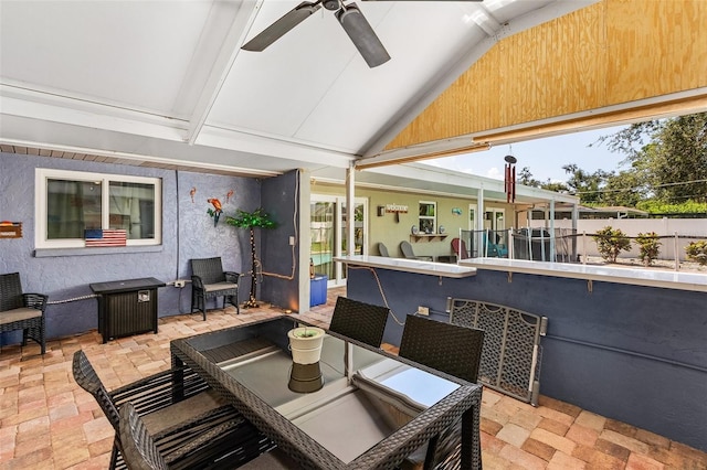 view of patio / terrace with ceiling fan and exterior bar