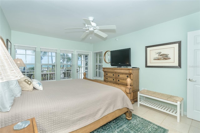 tiled bedroom featuring ceiling fan