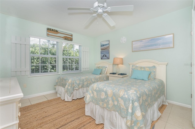 bedroom with light tile patterned floors and ceiling fan