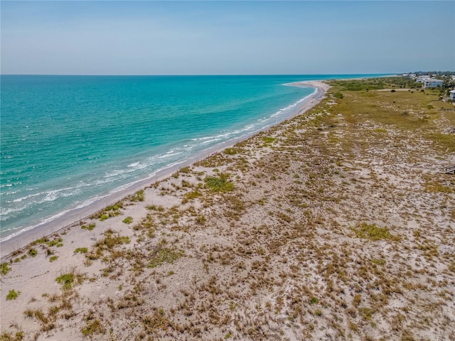 property view of water featuring a beach view