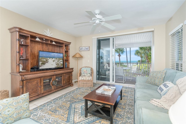 living room featuring ceiling fan and light tile patterned floors