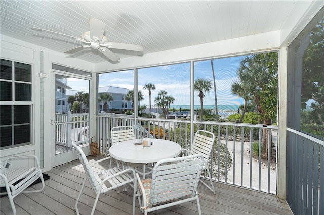 sunroom / solarium with ceiling fan