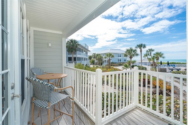 balcony featuring a water view