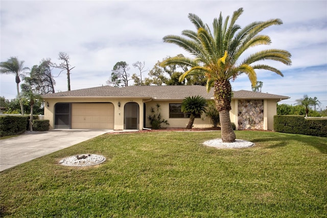 ranch-style house featuring a front lawn and a garage