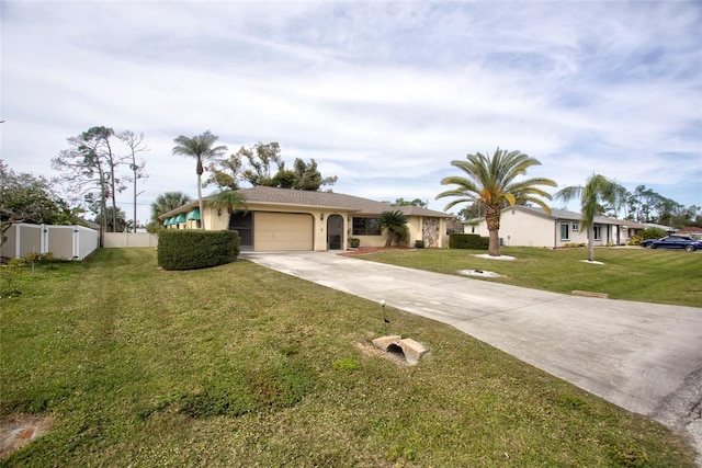 ranch-style house featuring a garage and a front lawn