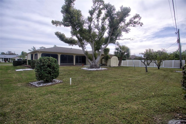 view of yard featuring a storage unit