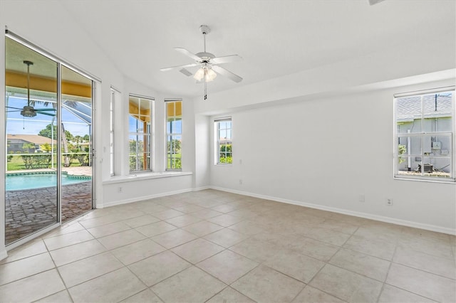 tiled empty room featuring ceiling fan