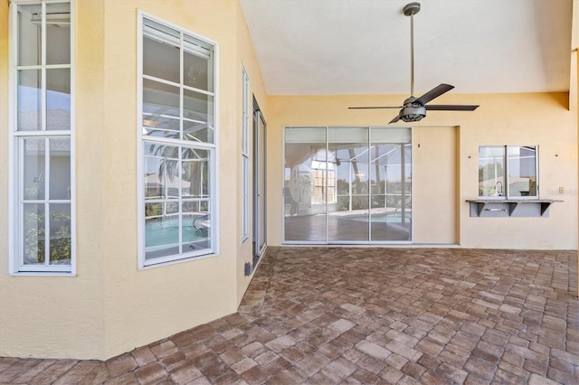 view of patio featuring ceiling fan