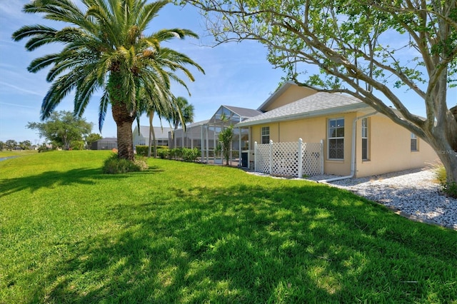 view of yard featuring a lanai