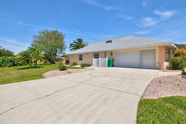 ranch-style house featuring a garage