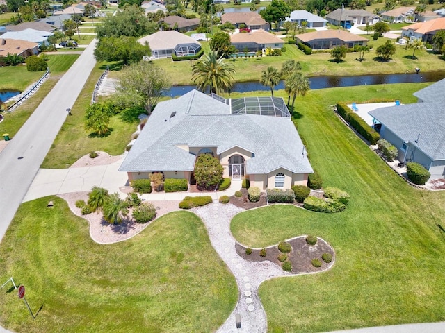 birds eye view of property featuring a water view