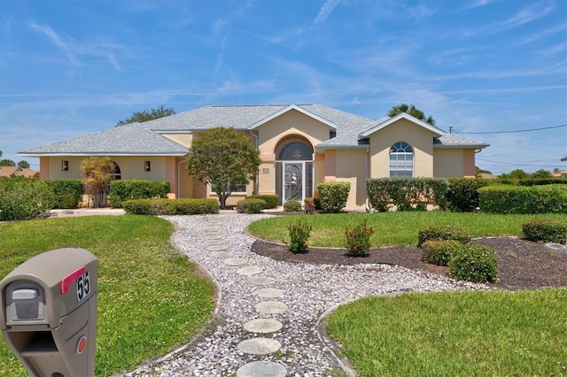 single story home with a front yard