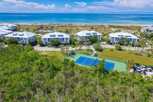 bird's eye view featuring a beach view and a water view