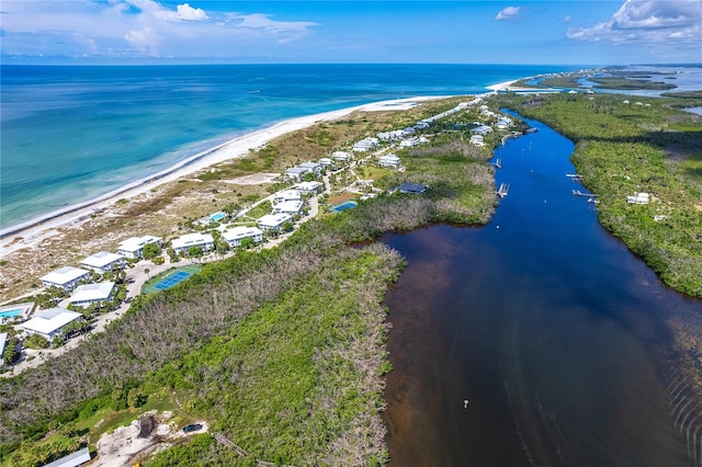 drone / aerial view with a water view and a view of the beach