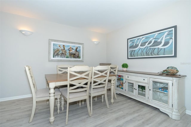 dining space featuring light hardwood / wood-style flooring