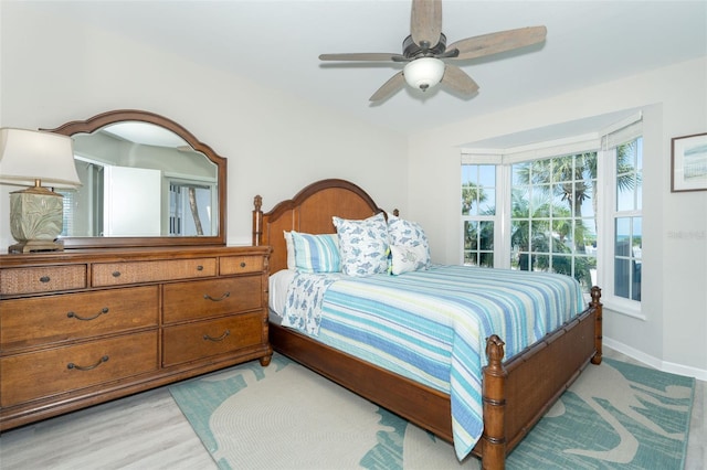 bedroom featuring ceiling fan and light hardwood / wood-style flooring