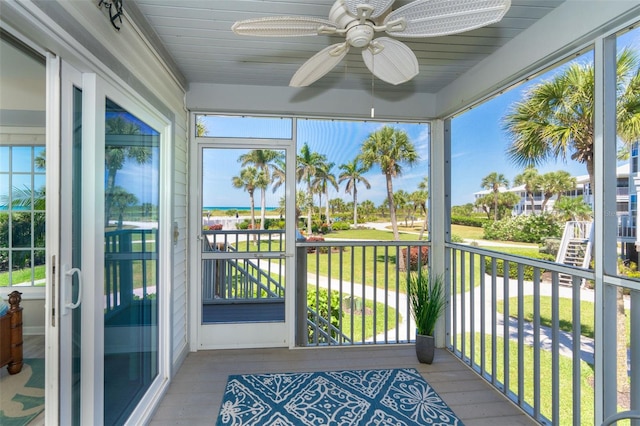 sunroom / solarium with ceiling fan and a wealth of natural light