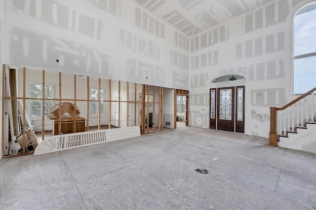 entryway with a towering ceiling and plenty of natural light