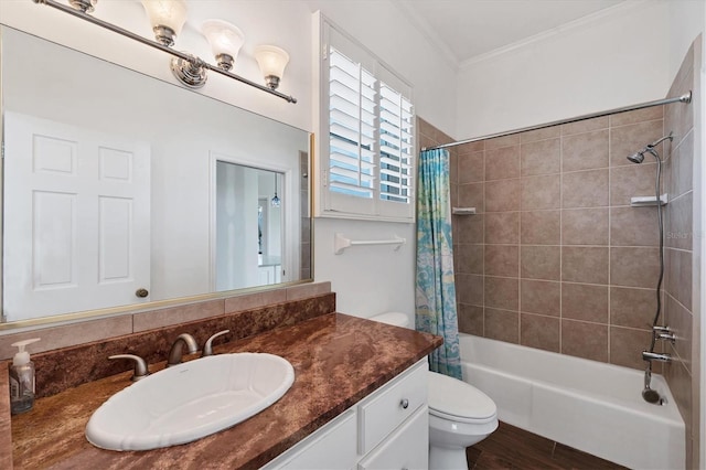 full bathroom featuring shower / bath combo, toilet, hardwood / wood-style floors, crown molding, and vanity