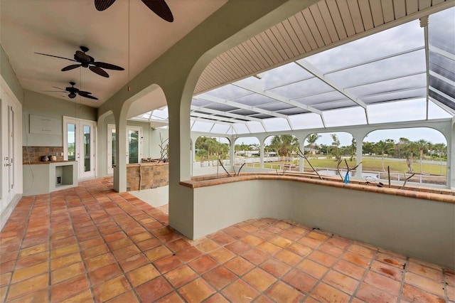 view of patio with exterior kitchen and ceiling fan