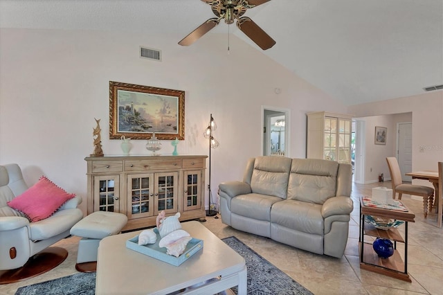 living room with light tile floors, ceiling fan, and high vaulted ceiling