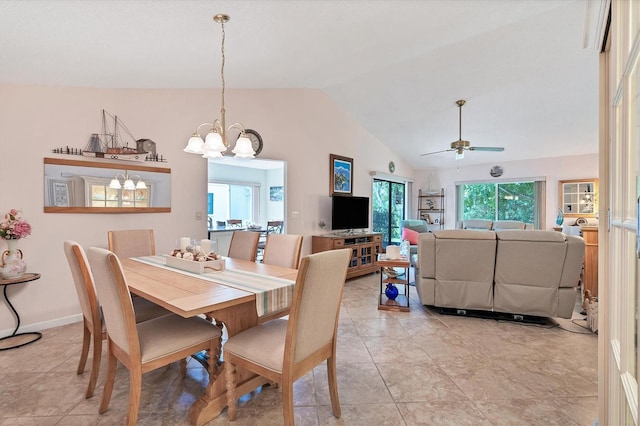 dining room with high vaulted ceiling, light tile flooring, and ceiling fan with notable chandelier