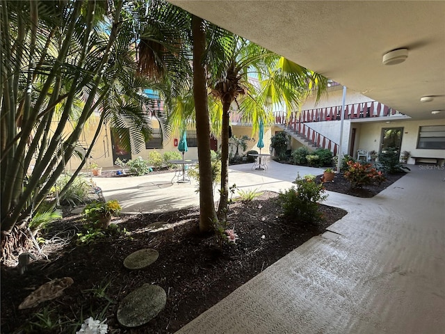 view of property's community featuring a patio