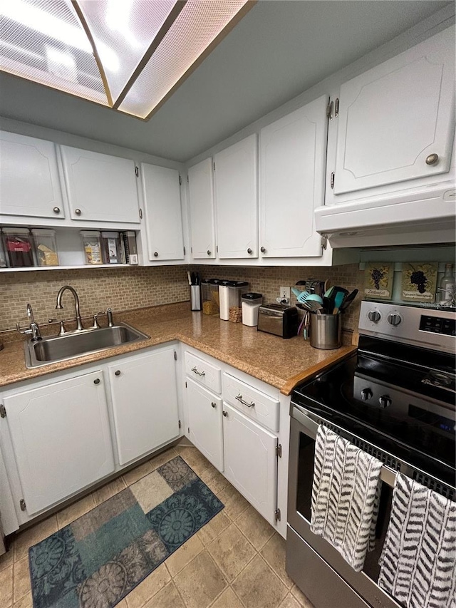 kitchen with tasteful backsplash, sink, white cabinets, and stainless steel electric range oven