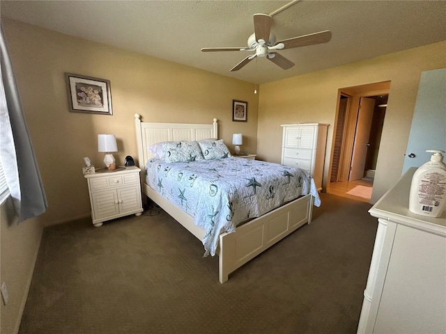 bedroom featuring dark carpet and ceiling fan