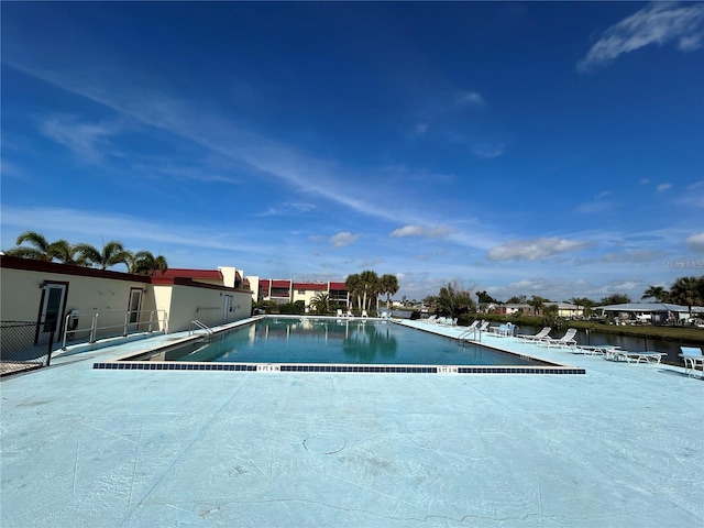 view of pool with a water view