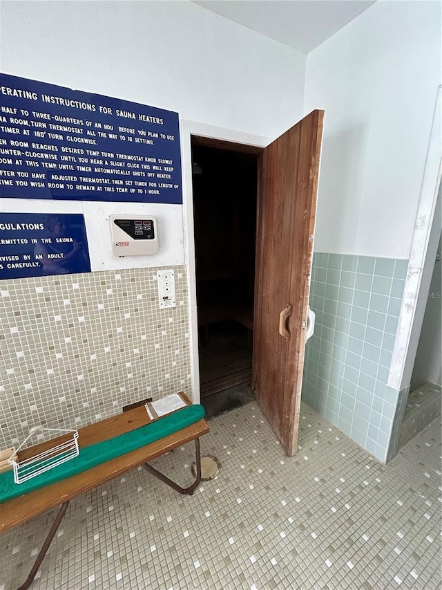 interior space featuring tile walls and tile patterned floors