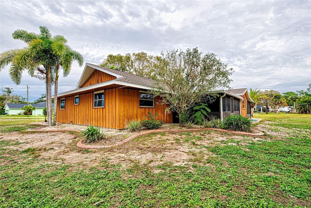 view of home's exterior with a yard